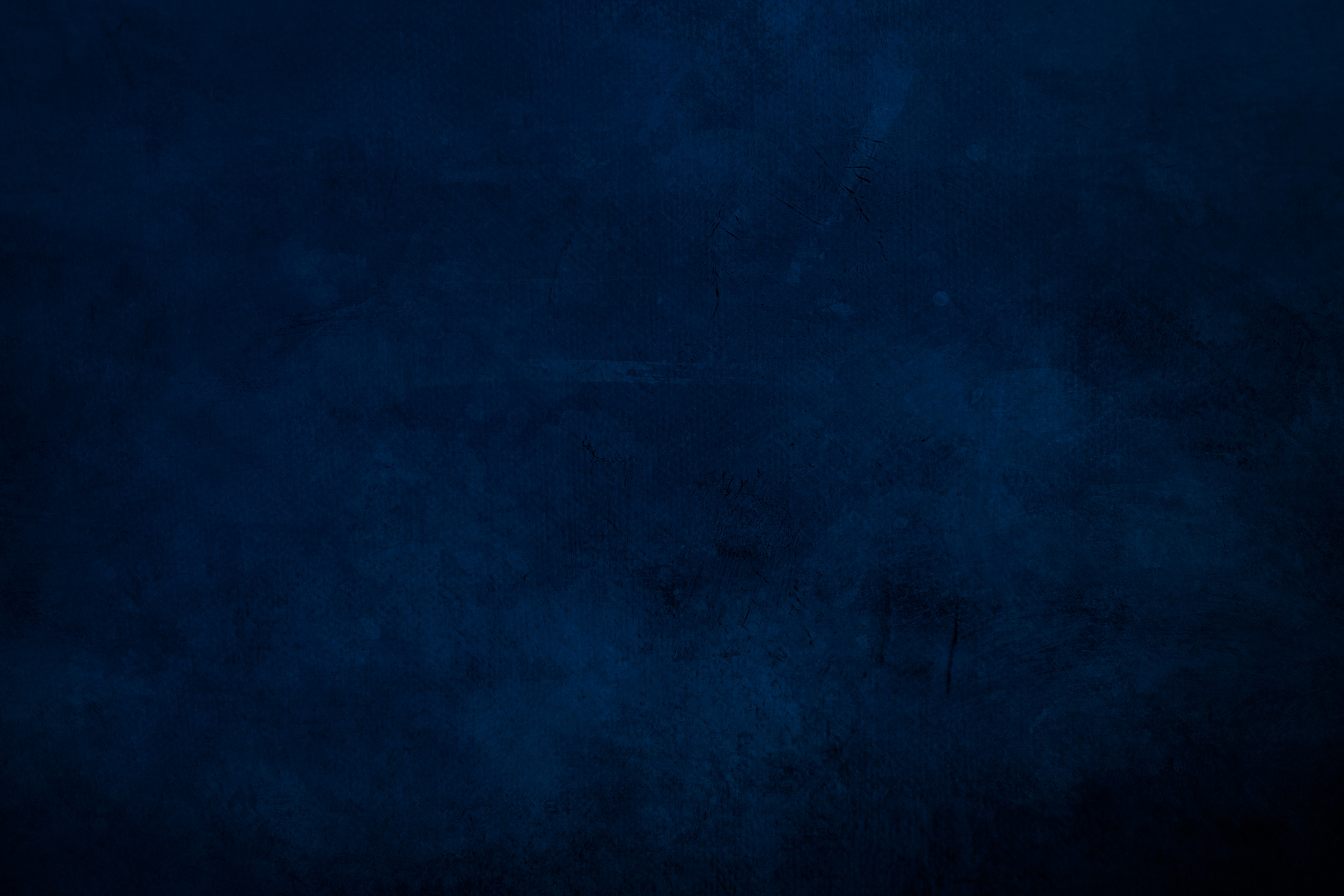 DArk blue  grungy canvas background or texture with dark vignette borders